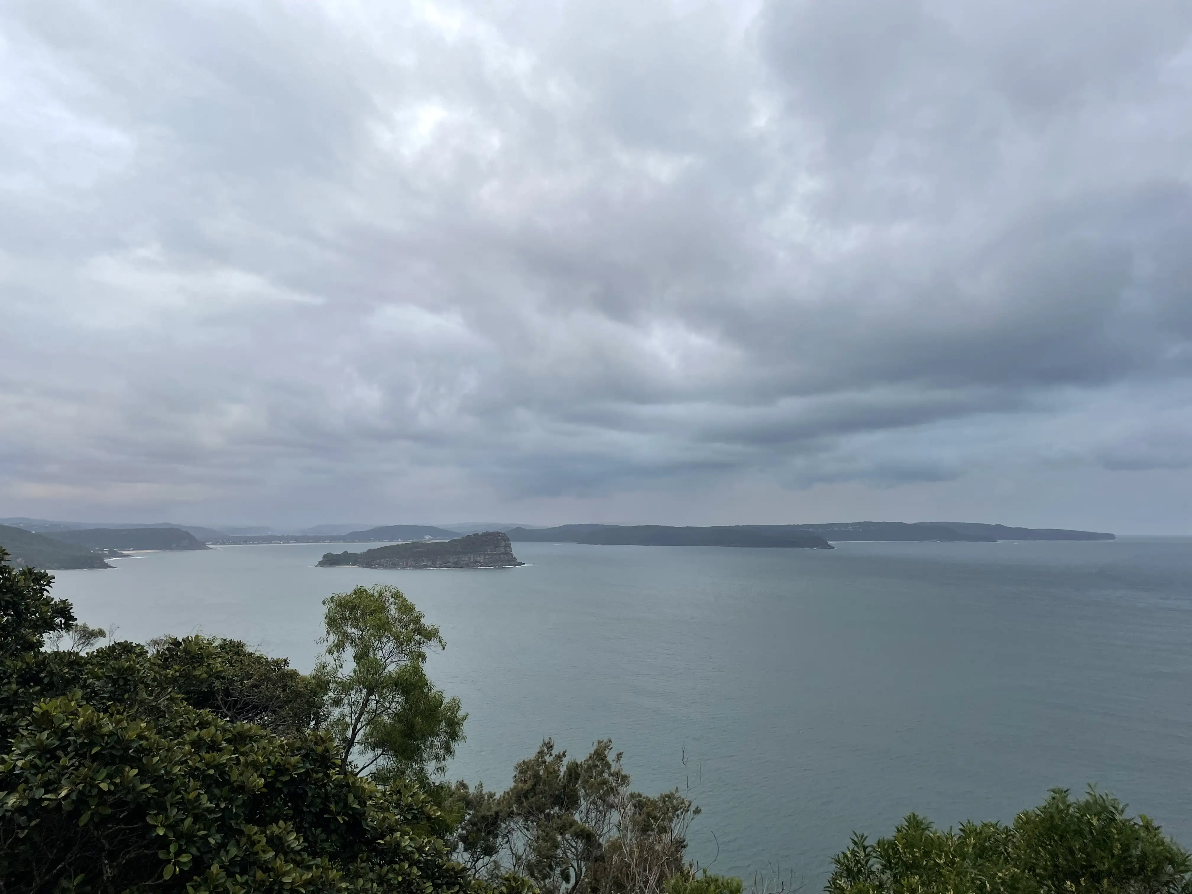 West Head Lookout, view of green islands in the Ocean, near Sydney, in a national park with majestic trees